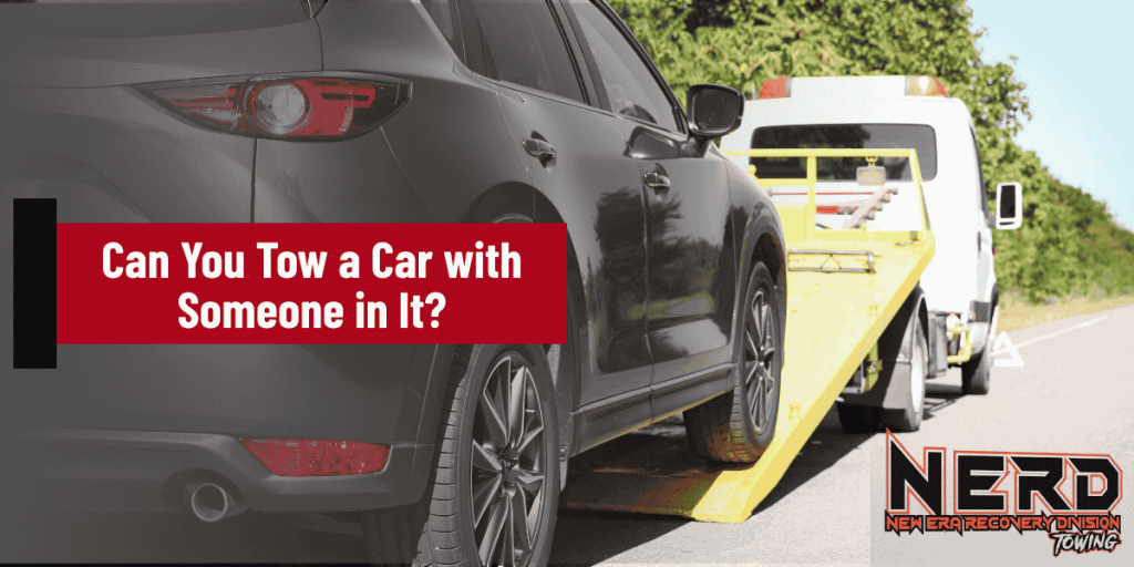 Can You Tow a Car with Someone in It?